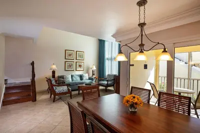 a living room and dining room with a dining table at Sheraton Vistana Resort Villas, Lake Buena Vista Orlando in Orlando