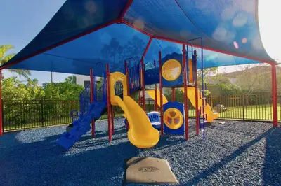 a playground with a slide in a park at Vista Cay at Epic Universe - Luxury 4 bedroom condo in Orlando