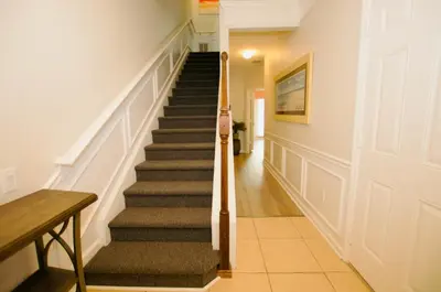 a staircase in a home with a stair case at Vista Cay at Epic Universe - Luxury 3 bedroom Townhouse in Orlando