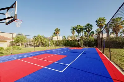 a tennis court with a basketball hoop at Vista Cay at Epic Universe - Luxury 3 bedroom Townhouse in Orlando