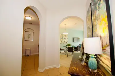a hallway with a living room and a dining room at Vista Cay at Epic Universe - Standard 2 bedroom condo in Orlando