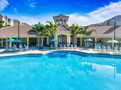 a large swimming pool in front of a hotel at Vista Cay at Epic Universe - Standard 2 bedroom condo in Orlando