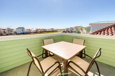 a table and chairs on a balcony with a view at Smooth Sailing Cottage With Private Pool Near Disney And Margaritaville Resort & Island H20 Waterpark Access - 7992Sh in Orlando