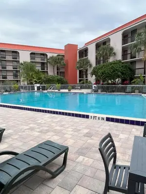 a swimming pool in front of a building at Grand Hotel Orlando at Universal Blvd - Shuttle to Theme Parks in Orlando