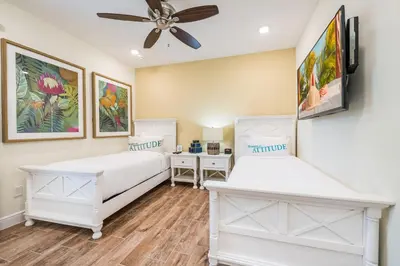 a bedroom with two beds and a ceiling fan at Tranquil Ocean Blue Cottage Near Disney With Private Pool & Margaritaville Resort & Island H20 Waterpark Access - 3000Ph in Orlando