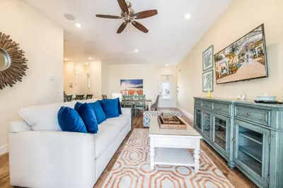 a living room with a white couch and a ceiling fan at Tranquil Ocean Blue Cottage Near Disney With Private Pool & Margaritaville Resort & Island H20 Waterpark Access - 3000Ph in Orlando