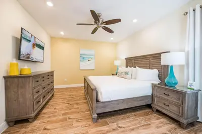 a bedroom with a bed and a ceiling fan at Tranquil Ocean Blue Cottage Near Disney With Private Pool & Margaritaville Resort & Island H20 Waterpark Access - 3000Ph in Orlando