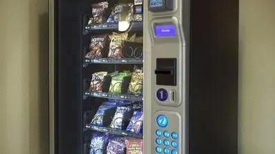 a vending machine full of chips and other snacks at Galleria Palms Orlando - Free Theme Park Shuttles in Orlando