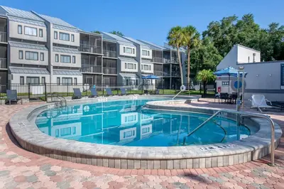 a swimming pool in front of a building at Orbit One Vacation Villas in Orlando