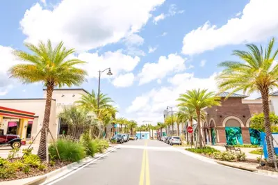 a street in a town with palm trees at Blue Oasis Near Disney With Margaritaville Resort & Island H2O Access - 8049Sh in Orlando