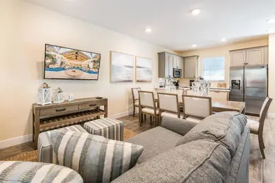 a living room with a couch and a table at Blue Oasis Near Disney With Margaritaville Resort & Island H2O Access - 8049Sh in Orlando