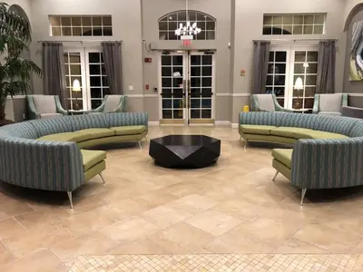 a lobby with couches and a table in a room at 13-403 Your Vista Cay Home in Orlando