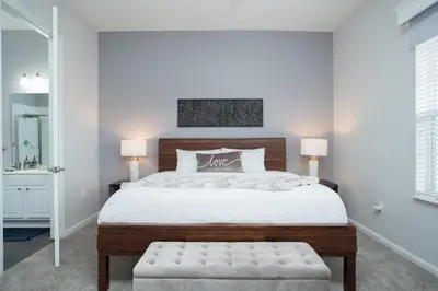 a bedroom with a large bed and two lamps at 2-403 Your Vista Cay Condo in Orlando