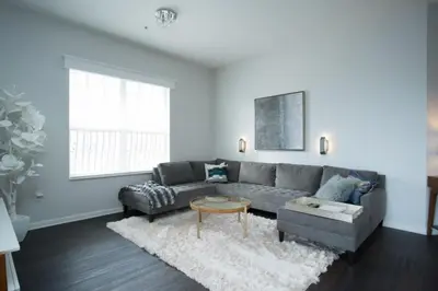 a living room with a gray couch and a table at 2-403 Your Vista Cay Condo in Orlando