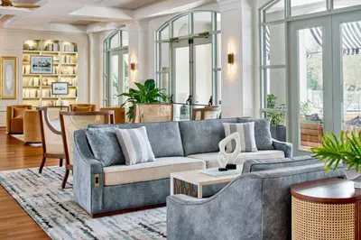 a living room with a couch and a table at The Inn at Celebration, Autograph Collection in Orlando
