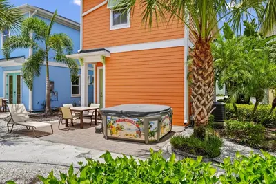 a house with a fish tank in front of a house at Teenie Bikini Cottage With Private Hot Tub Near Disney With Margaritaville Resort & Island H2O Access - 3071Kl in Orlando