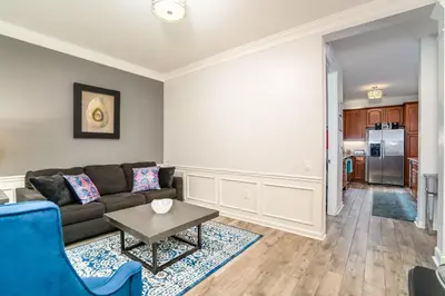 a living room with a couch and a table at Orlando Escape in Orlando