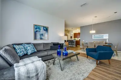 a living room with a couch and a table at Orlando Escape in Orlando