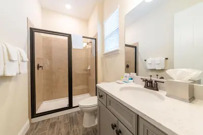 a bathroom with a shower and a toilet and a sink at Nautical Cottage With Private Hot Tub Near Disney With Margaritaville Resort & Island H2O Access - 3044Sr in Orlando