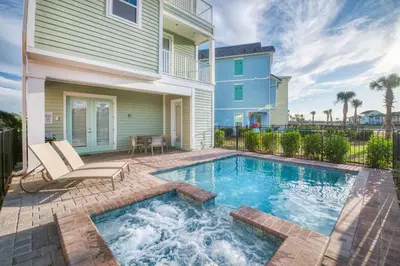 a swimming pool in front of a house at Spacious Cottage With Private Pool Near Disney With Margaritaville Resort & Island H2O Access - 8009Su in Orlando