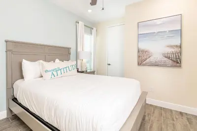 a white bedroom with a large white bed and a window at Fun In The Sun Cottage With Private Pool Near Disney With Margaritaville Resort & Island H2O Access - 8052Sh in Orlando