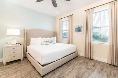 a white bedroom with a bed and a window at High Tide Cottage With Private Pool Near Disney With Margaritaville Resort & Island H2O Access - 8053Su in Orlando