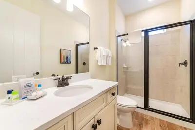 a bathroom with a sink and a toilet and a shower at Fiesta Siesta Cottage With Hot Tub Near Disney With Margaritaville Resort & Island H2O Access - 8068Dr in Orlando