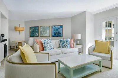 a living room with a couch and a table at Gaylord Palms Resort & Convention Center in Orlando