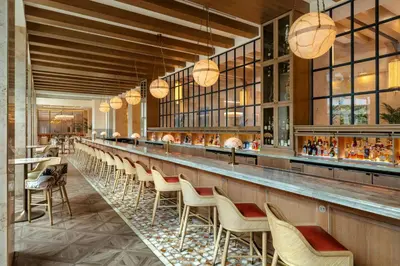 a bar at a restaurant with chairs and tables at Gaylord Palms Resort & Convention Center in Orlando