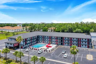 an aerial view of a hotel with a pool at Seasons Florida Resort in Kissimmee