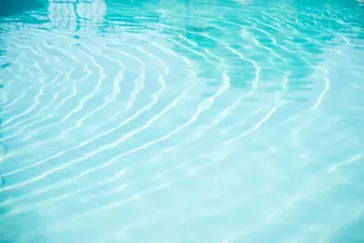 a close up of the water in a swimming pool at Seasons Florida Resort in Kissimmee