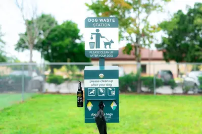 a sign for a dog waste station in a yard at FantasyWorld Resort in Kissimmee
