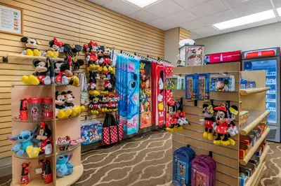 a room filled with lots of stuffed toys on shelves at Comfort Suites Maingate East in Orlando