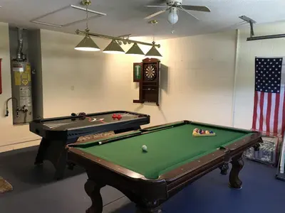 a room with a pool table and an american flag at #503 Stunning 4 Bed, 3 bath villa with southwest facing pool and spa in Orlando