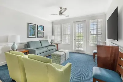 a living room with a couch and a chair at Hilton Vacation Club Grand Beach Orlando in Orlando