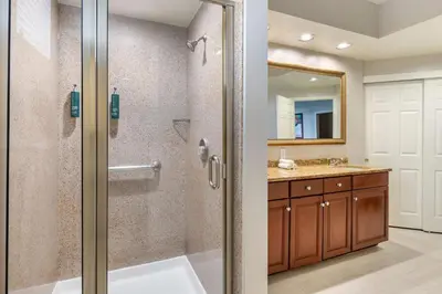 a bathroom with a shower and a sink at Hilton Vacation Club Grande Villas Orlando in Orlando