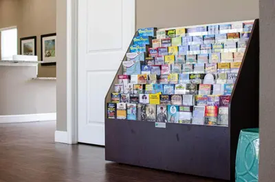 a display of books on a wall next to a door at Amazing Townhouse in gated community 10' to Disney! in Kissimmee
