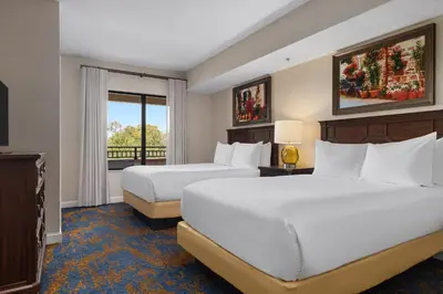 a hotel room with two beds and a window at Club Wyndham Bonnet Creek in Orlando