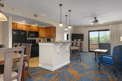 a kitchen and dining room with a table and chairs at Club Wyndham Bonnet Creek in Orlando