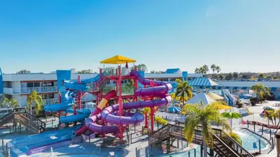 a water park with a water slide at a resort at Ramada by Wyndham Flamingo Water Park in Kissimmee
