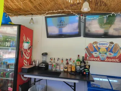 a counter with a bunch of bottles on it at Lakeview Condo Hotel near Disney in Orlando