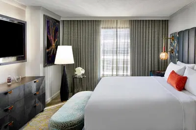 a hotel room with a large bed and a window at Grand Bohemian Orlando, Autograph Collection in Orlando
