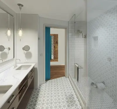 a bathroom with a shower and a sink and a mirror at The Alfond Inn in Orlando