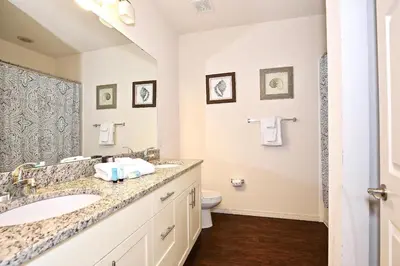a bathroom with a sink and a toilet at Great townhouse in great luxurious community, poolgym Close to Disney! in Kissimmee