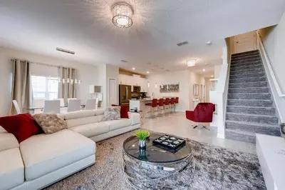 a living room with a couch and a table at 4825 LL - Storey Lake in Kissimmee