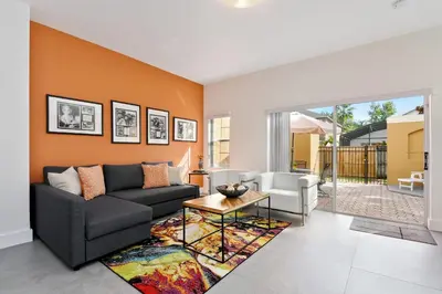 a living room with a couch and a table at 139PBD-SVH Lovely New Townhome! in Kissimmee