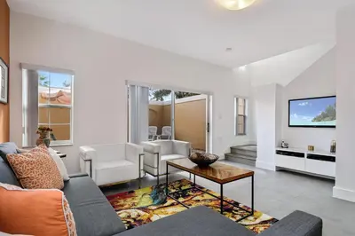 a living room with a couch and a table at 139PBD-SVH Lovely New Townhome! in Kissimmee