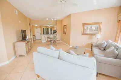 a living room with two couches and a tv at WorldQuest Orlando Resort in Orlando