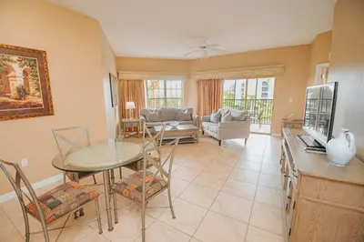 a living room with a table and a couch at WorldQuest Orlando Resort in Orlando