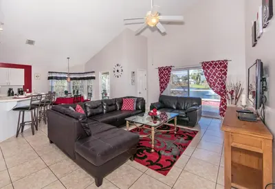 a living room with a couch and a table at Mickey's Lake Villa 2 in Orlando